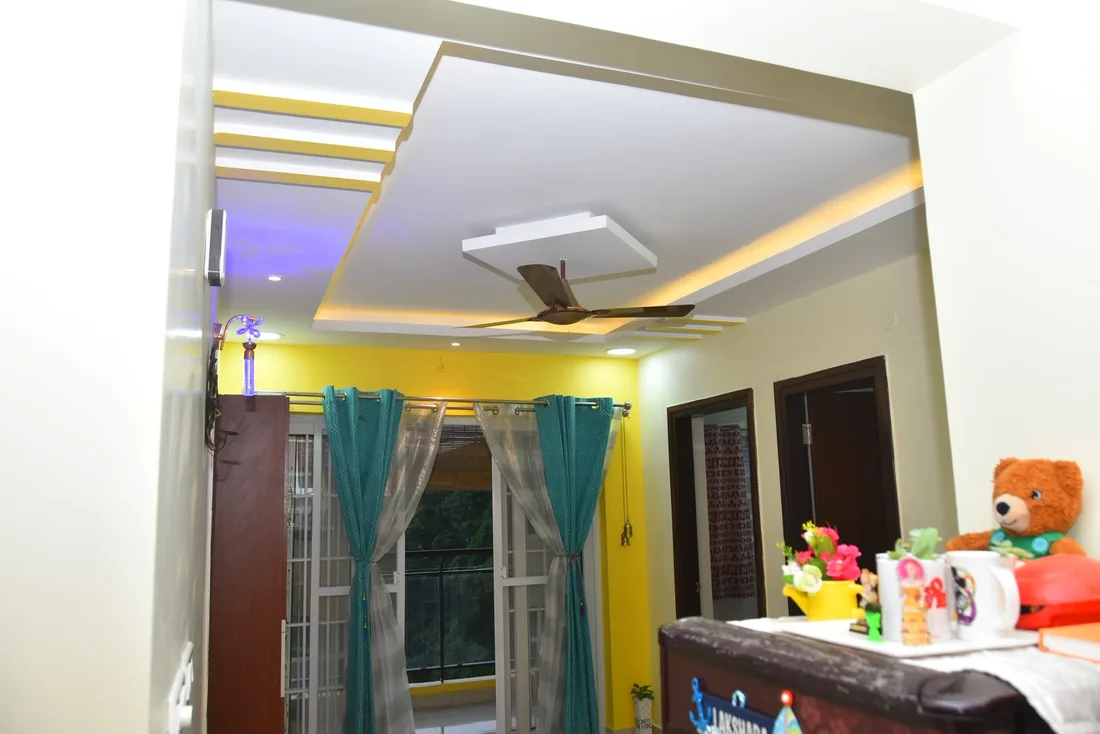 Finished bedroom corner with layered lighting and curtains